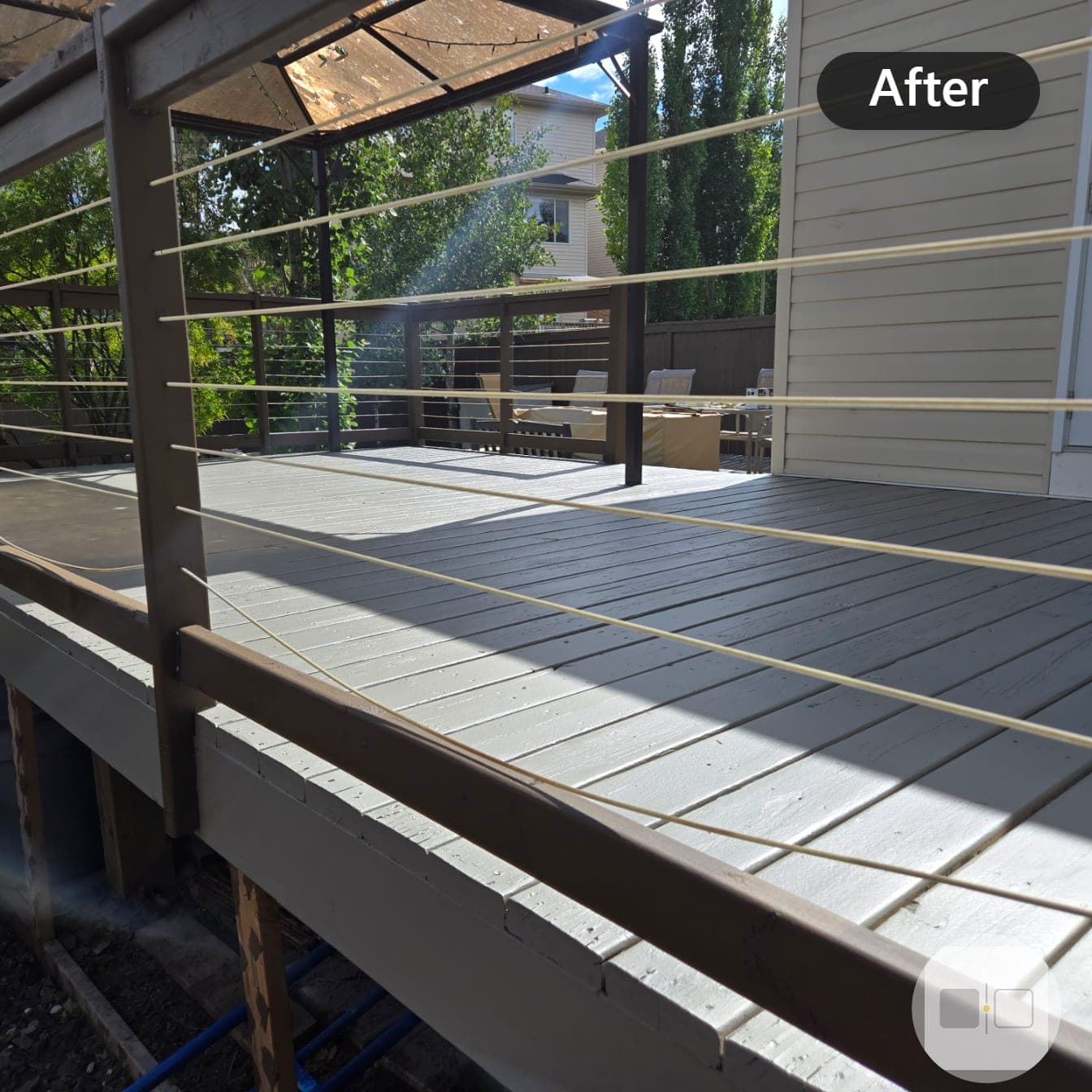 The same deck after refinishing in a solid grey-taupe coat