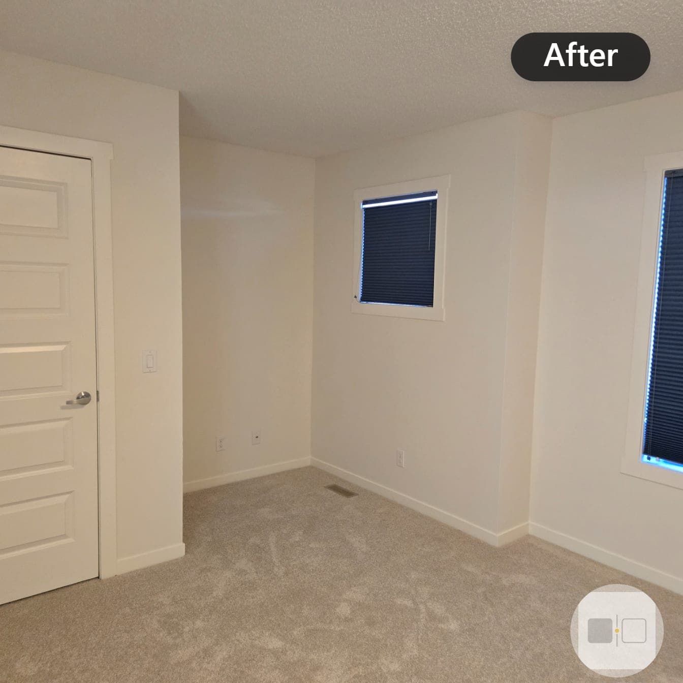 The same bedroom after painting, walls in warm cream with white trim and clean carpet